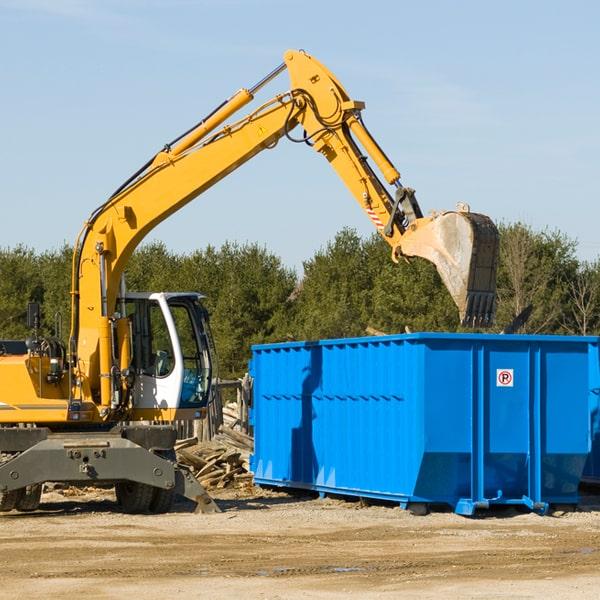 full residential dumpster on a driveway