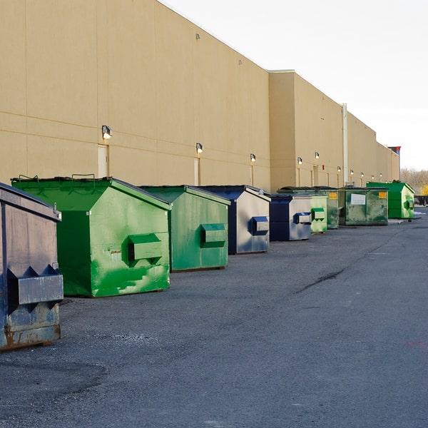 large commercial dumpster at an industrial warehouse